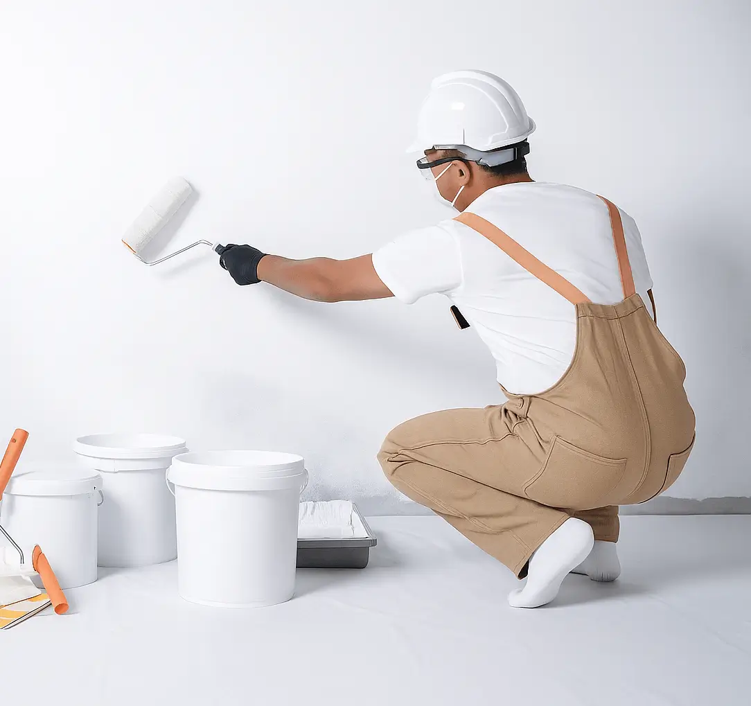 Painter painting a wall